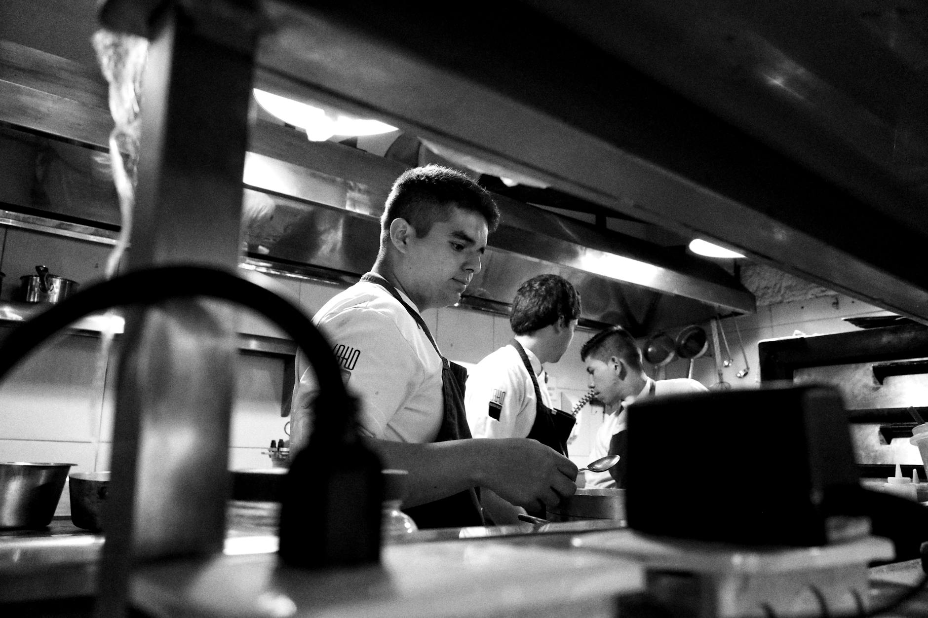 Professional restaurant kitchen with chefs working during busy service period