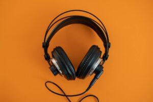 Person wearing headphones listening to music on streaming platform
