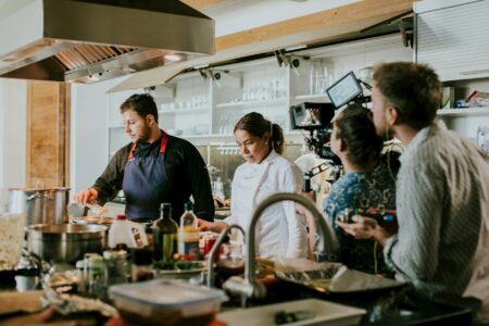 Why Food Delivery Apps Are Adding Live Chef Video Consultations Professional chef in commercial kitchen during video call consultation