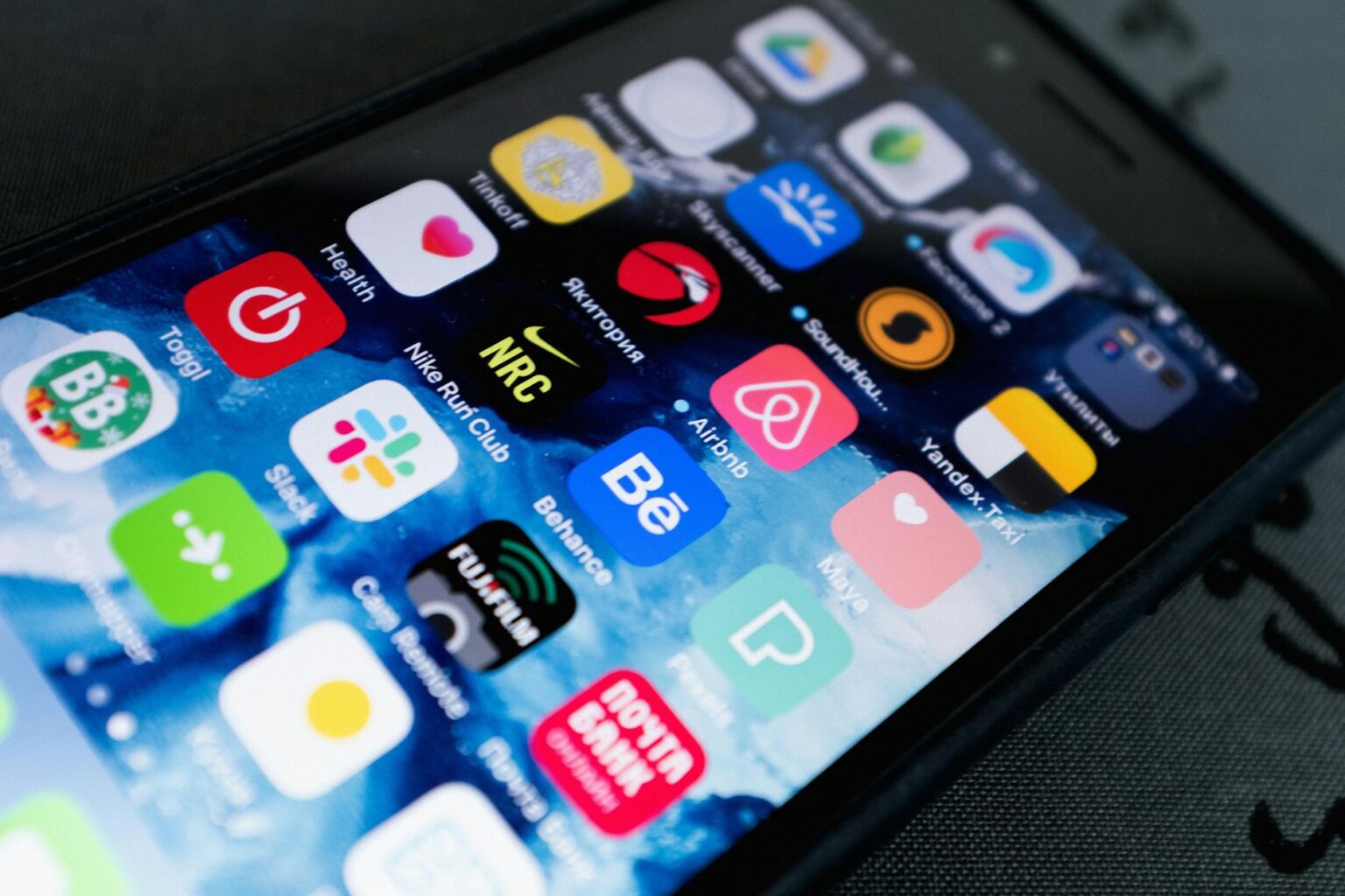 Close-up view of smartphone screen showing mobile app interface with clean, modern design elements