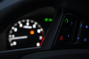 The Rise of AI Voice Assistants in Smart Car Integration Modern car dashboard with digital display and voice control interface