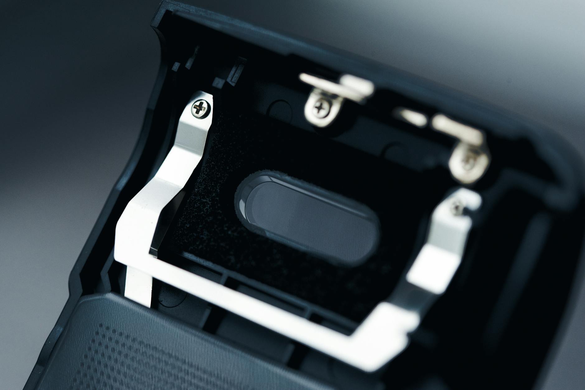 Person placing finger on biometric fingerprint scanner device for authentication