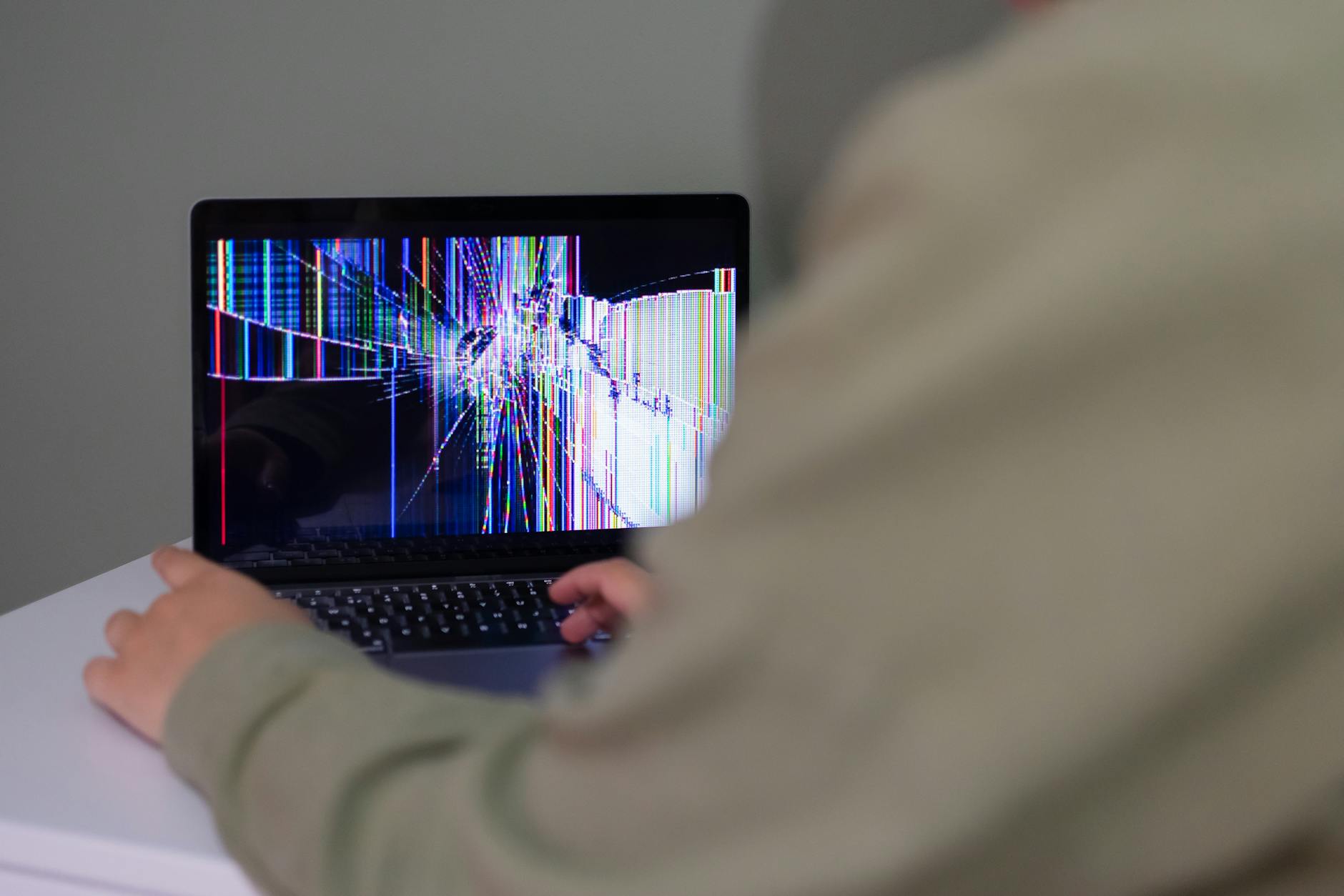 Laptop computer displaying text transcription software interface on screen