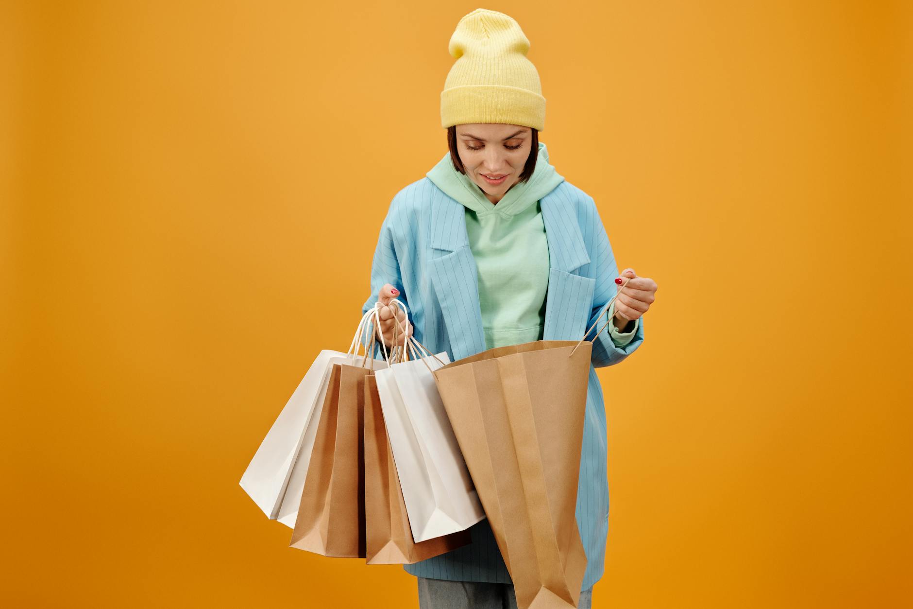 Customers shopping in retail store aisle with products on shelves