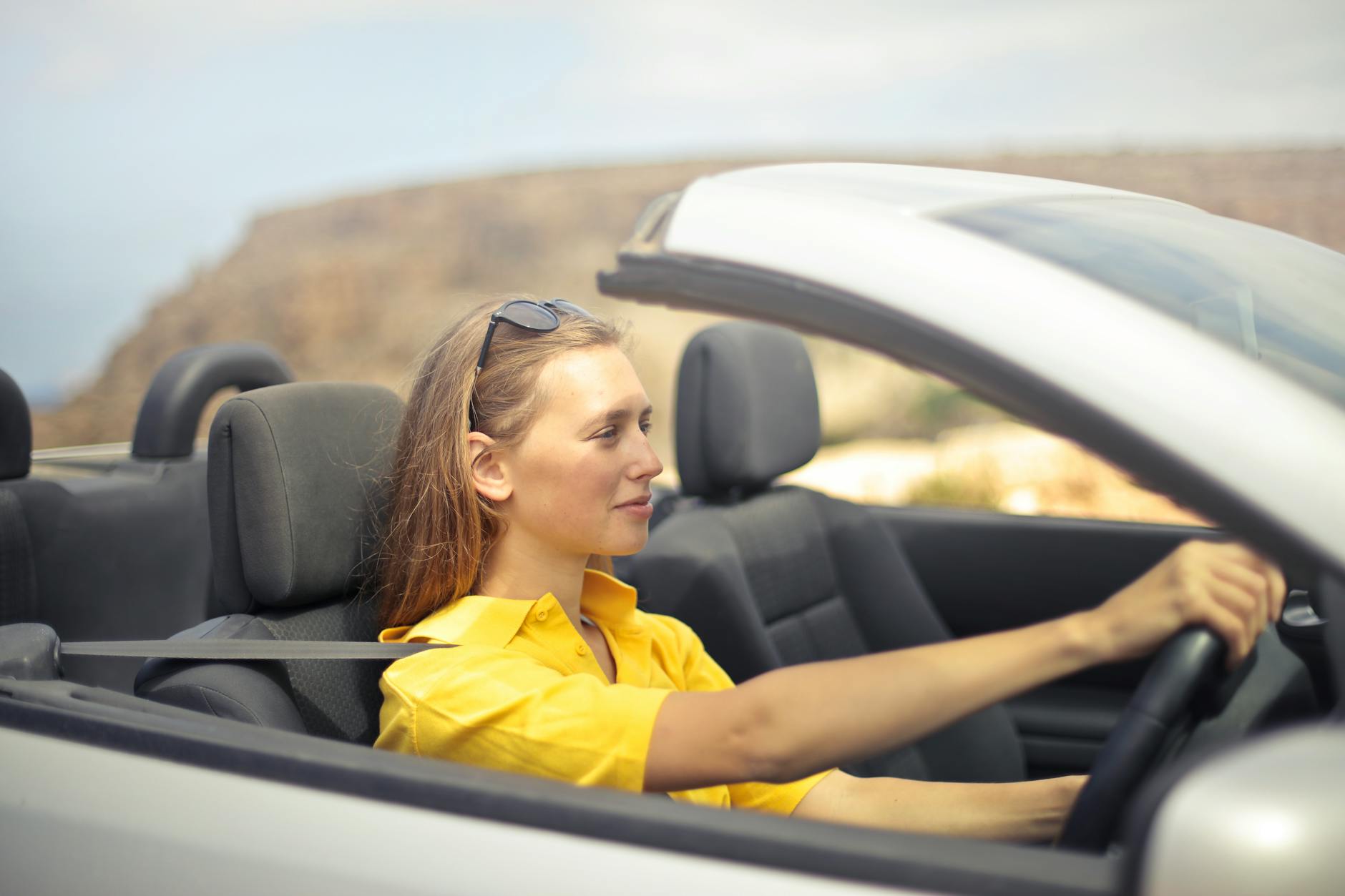 Woman using hands-free voice commands while driving safely
