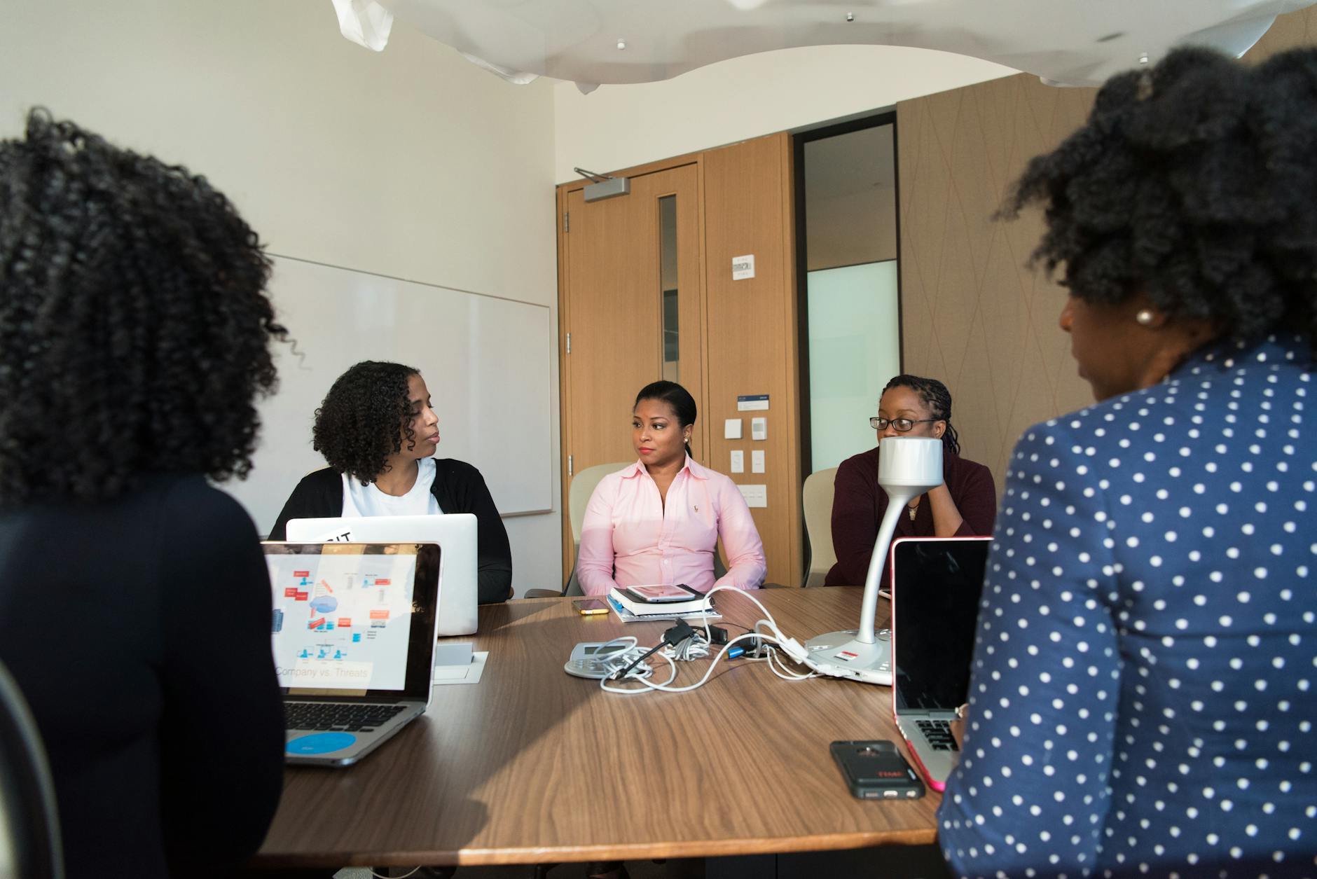 Business professionals in a modern office meeting discussing strategy and collaboration