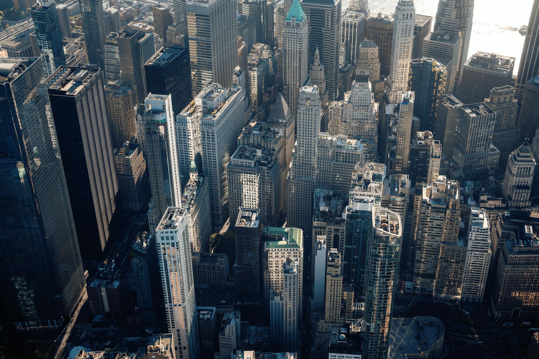 Aerial view of city skyline representing geographic dispersion of tech talent across different locations