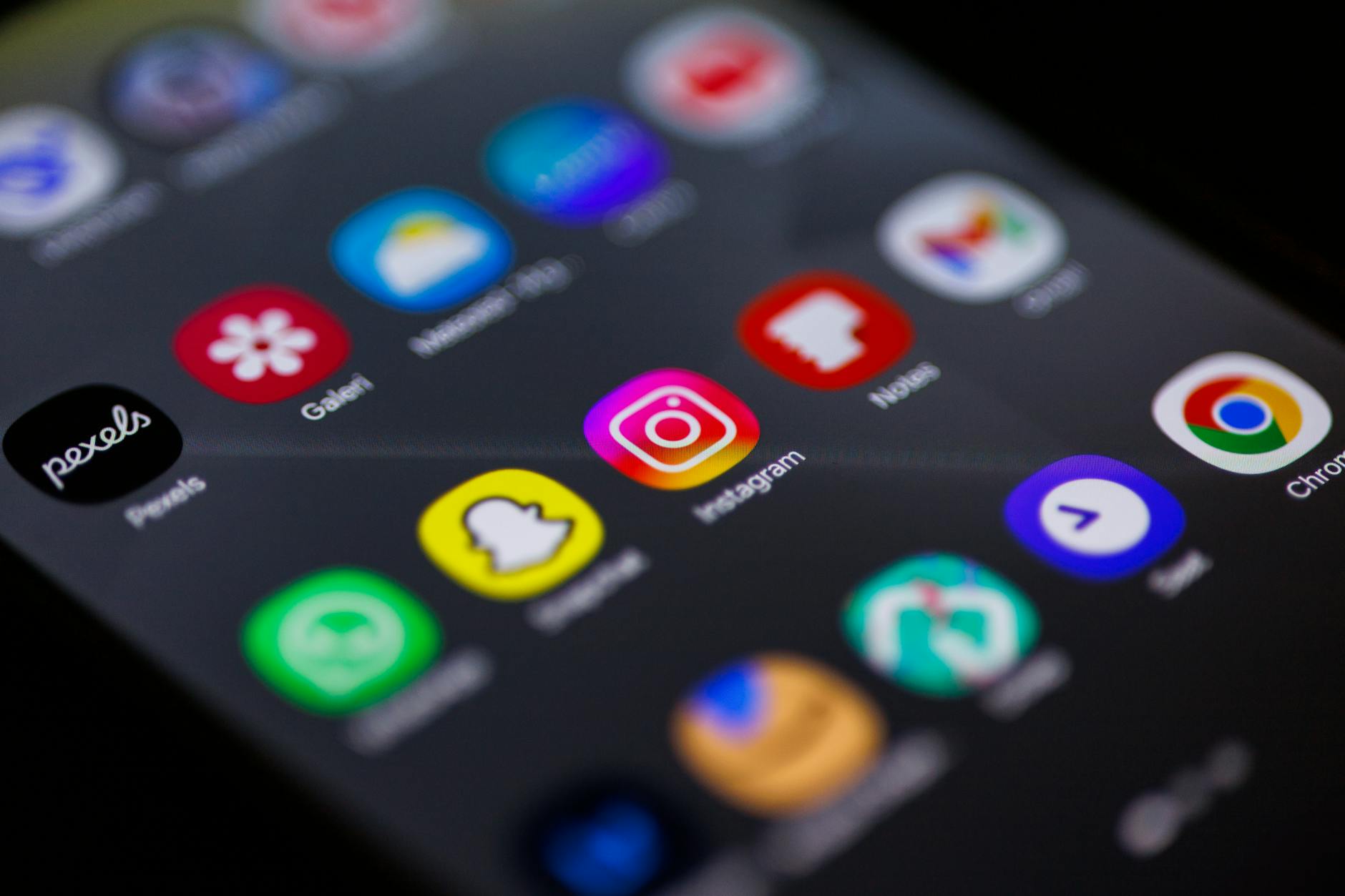 Person holding smartphone displaying Instagram interface with creator tools and monetization features