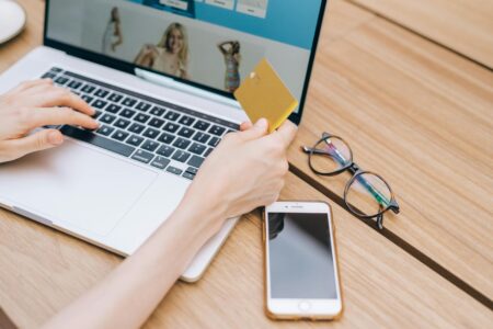 Stripe’s New Installment Payment Feature Is Reshaping E-Commerce Checkout Person completing online purchase on laptop showing checkout screen