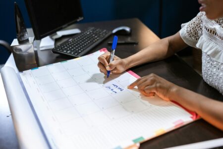 Notion AI’s Calendar Feature Is Quietly Stealing Productivity App Users Open planner and calendar on a clean desk workspace