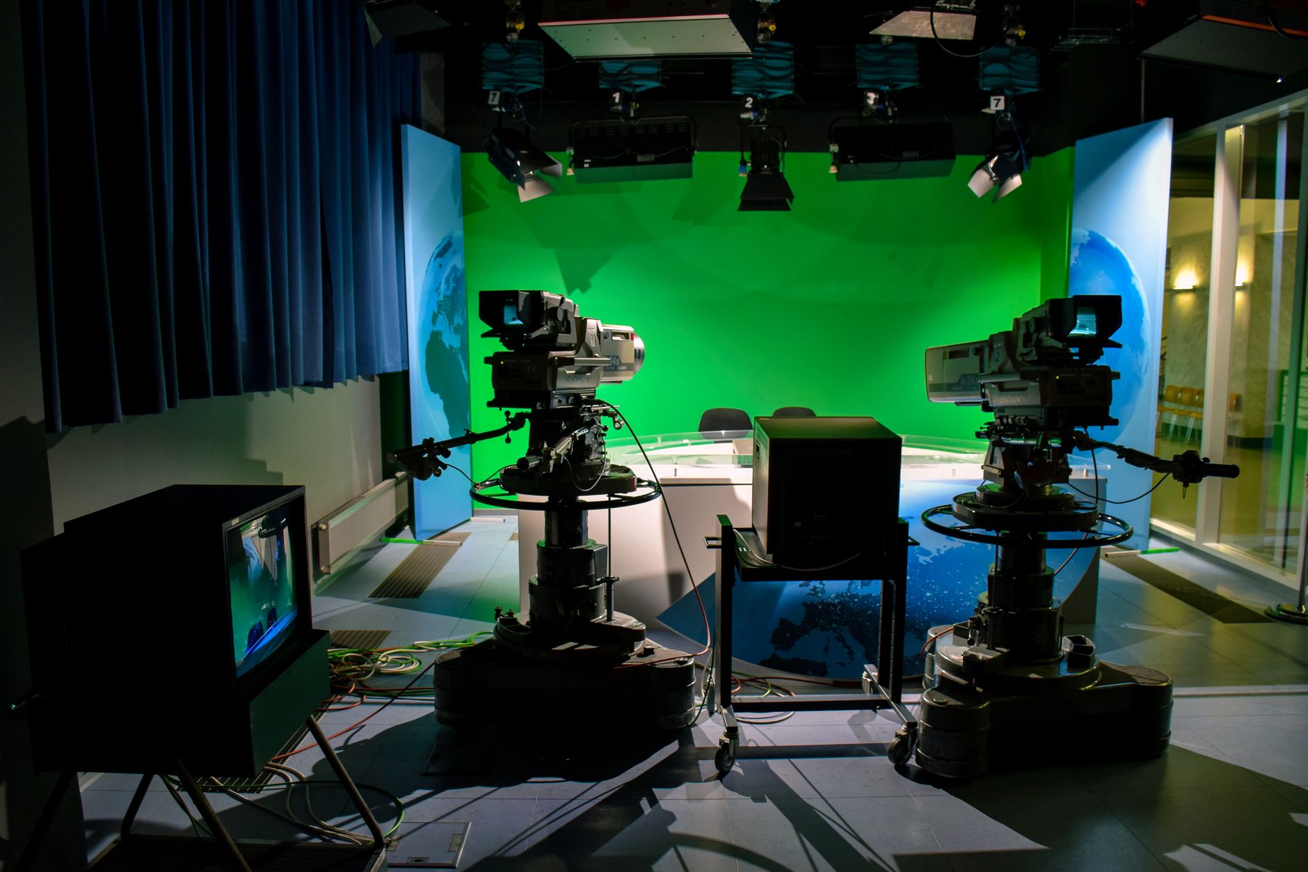 Small film production crew working on an indie movie set with cameras and lighting equipment