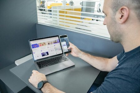 Perplexity’s Enterprise Push Is Rattling Google’s Workspace Business Modern office workspace with multiple screens showing productivity software
