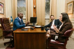 Harvey AI’s Legal Platform Is Squeezing Midsize Law Firm Budgets Empty law firm conference room with documents and laptops on a long table