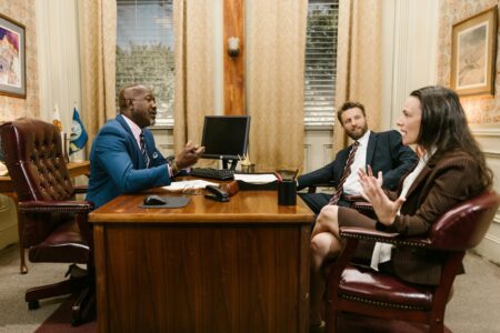 Harvey AI’s Legal Platform Is Squeezing Midsize Law Firm Budgets Empty law firm conference room with documents and laptops on a long table