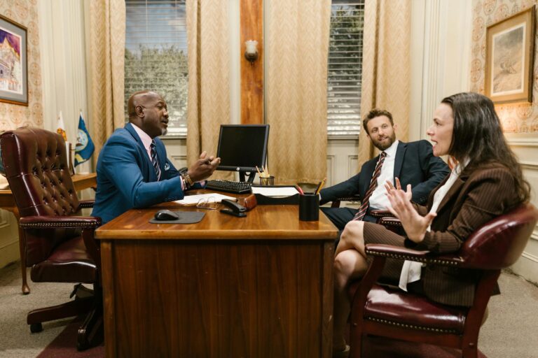 Harvey AI’s Legal Platform Is Squeezing Midsize Law Firm Budgets Empty law firm conference room with documents and laptops on a long table