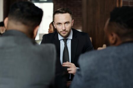 OpenAI’s ChatGPT Enterprise Rollout Faces Resistance from Legal Teams Corporate executives discussing technology implementation in conference room