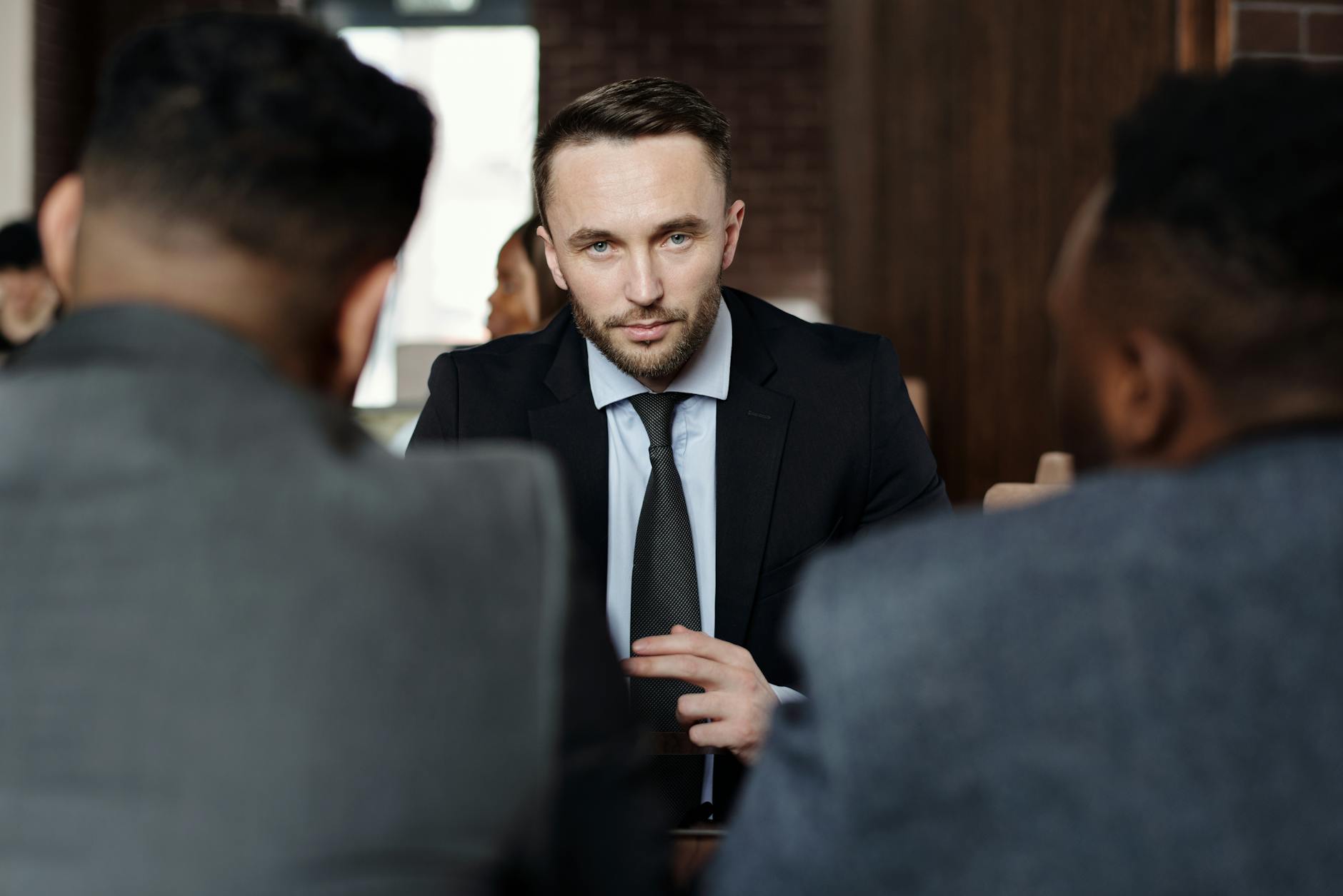 Corporate executives discussing technology implementation in conference room