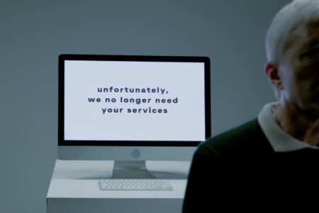 Amazon’s Alexa Team Faces Major Layoffs as Voice Assistant Usage Plateaus Empty office cubicles and desks representing workforce reduction