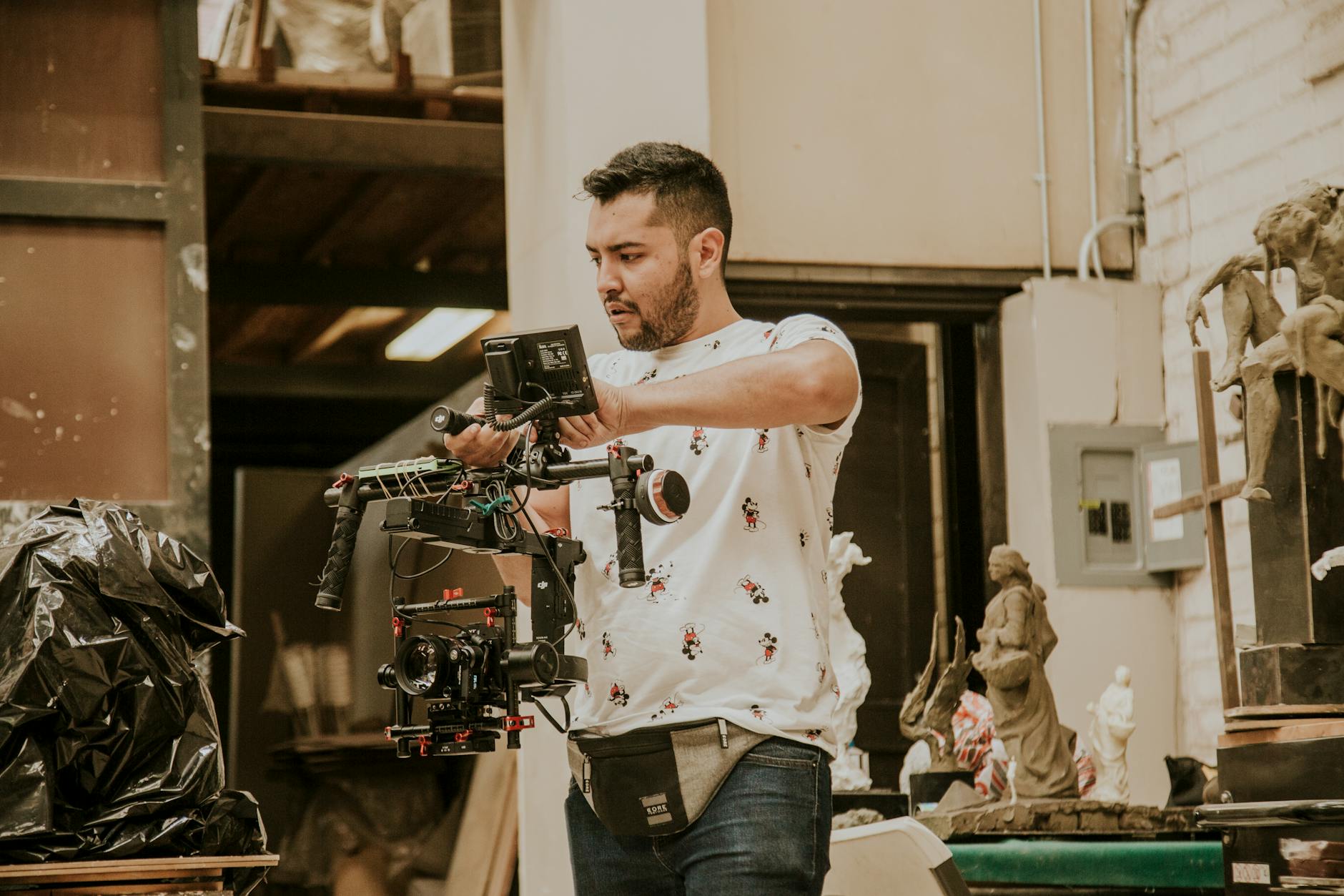 Filmmaker reviewing digital footage on a tablet during a low-budget production