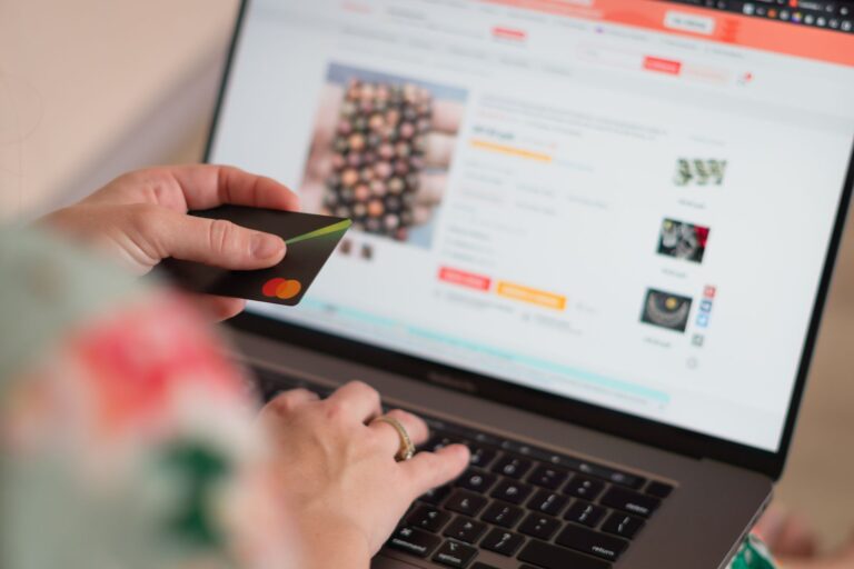 Perplexity’s AI Shopping Feature Is Undercutting Google’s Ad Business Person browsing and shopping online using a laptop computer