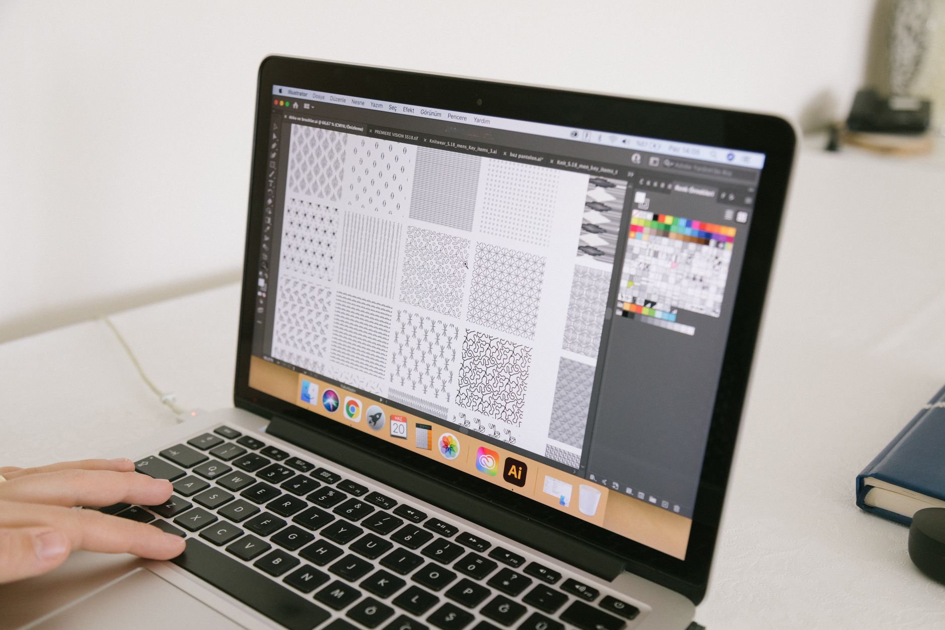 A designer working on a digital UI design tool interface on a modern computer screen