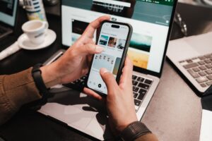 Glean’s New Agentic Features Are Pressuring Guru’s Enterprise Clients Employee using enterprise search software on a laptop in a modern office environment