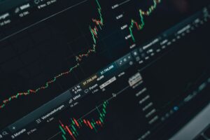 Klarna’s IPO Momentum Is Pressuring Affirm’s Investor Confidence Trader monitors showing stock market data and fintech company valuations