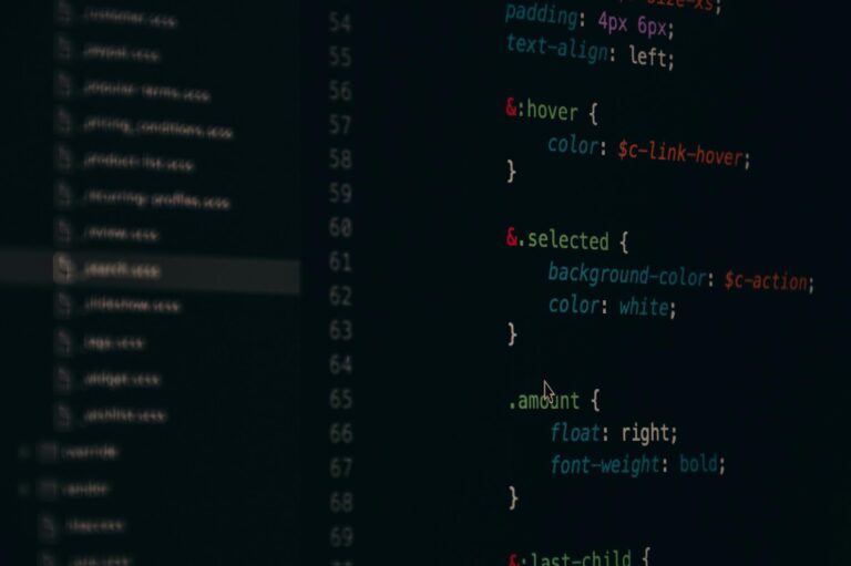 Developer working with a code editor on a desktop monitor