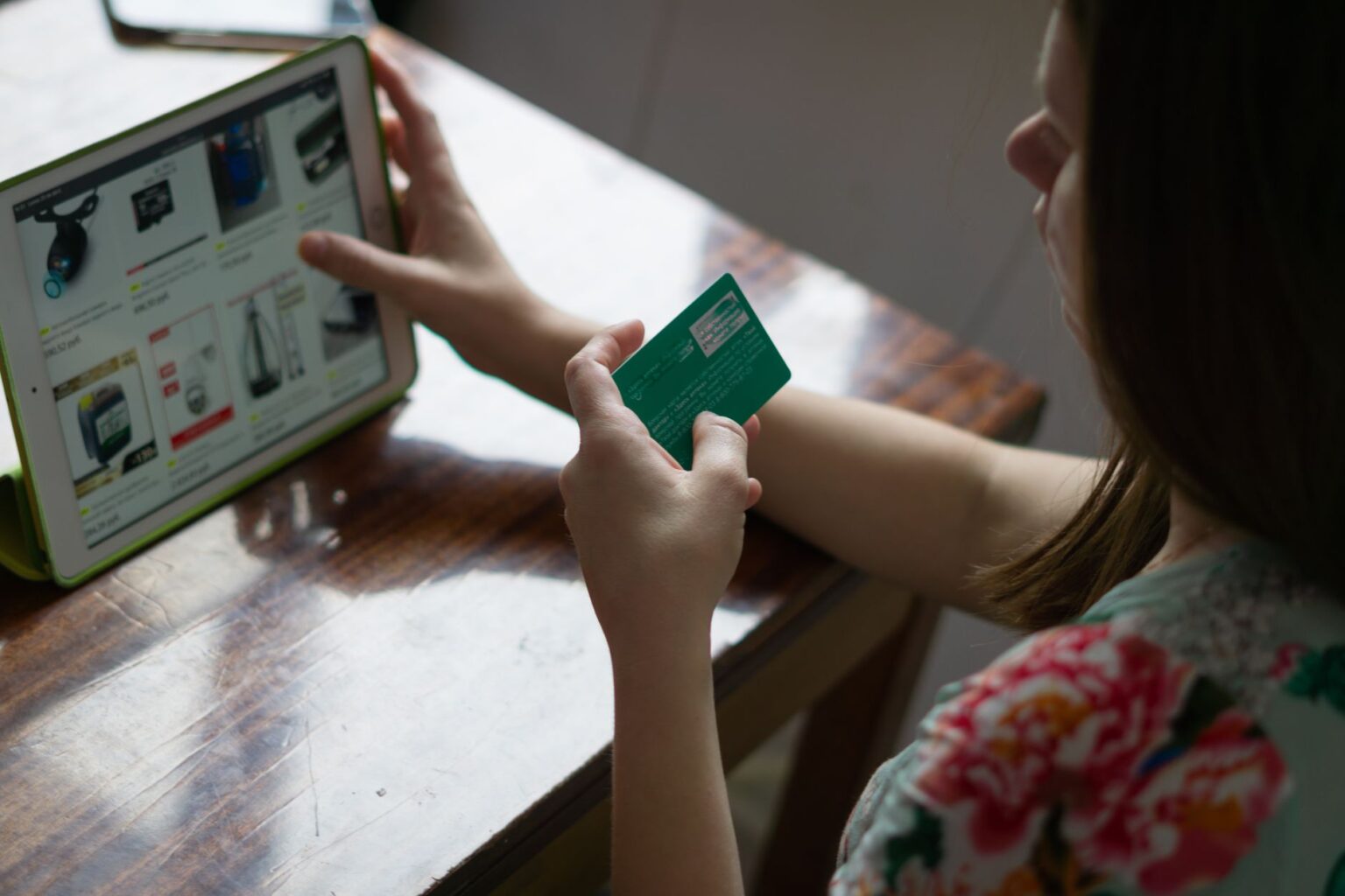 Person completing a purchase on a laptop at an online checkout screen