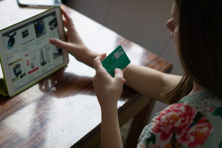 Bolt’s Checkout Platform Is Chipping Away at Shopify’s Payments Grip Person completing a purchase on a laptop at an online checkout screen