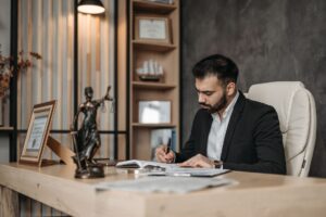 Harvey’s AI Legal Platform Is Squeezing Axiom’s Associate Pipeline Stack of legal documents on a professional desk representing contract review work