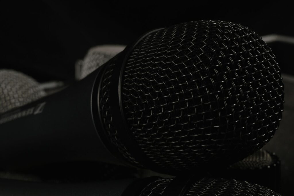 Wispr Flow’s AI Dictation Tool Is Squeezing Otter.ai’s Casual Users A close-up of a desktop microphone used for voice dictation and AI speech tools