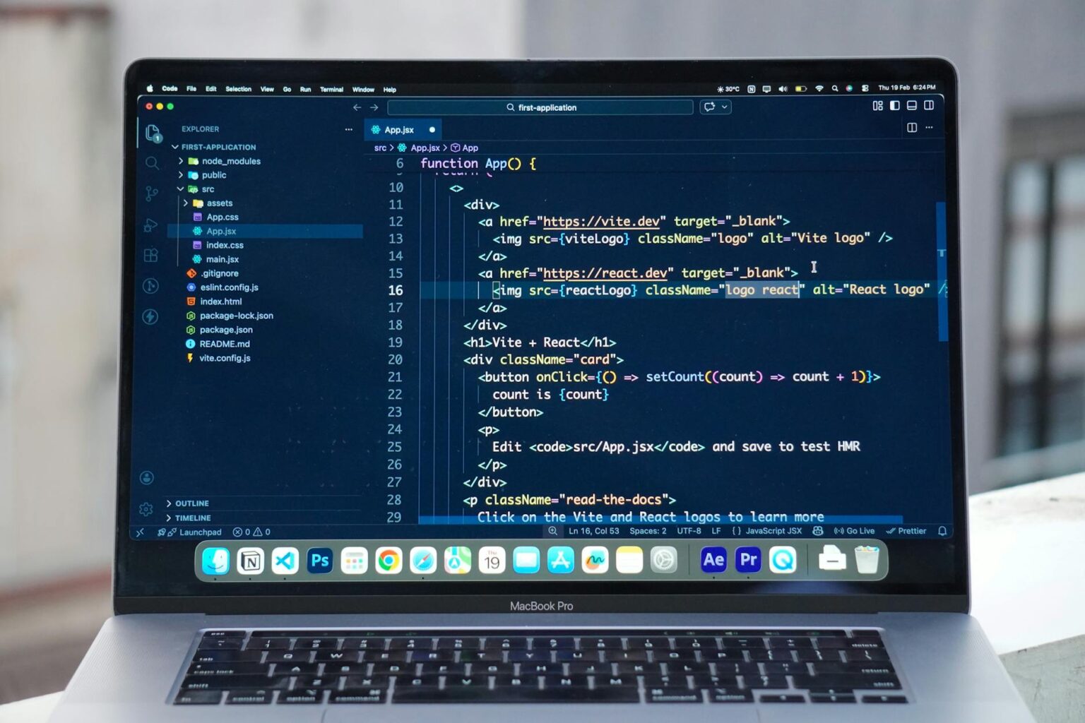 Developer working on a laptop building a web application