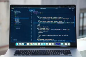 Developer working on a laptop building a web application