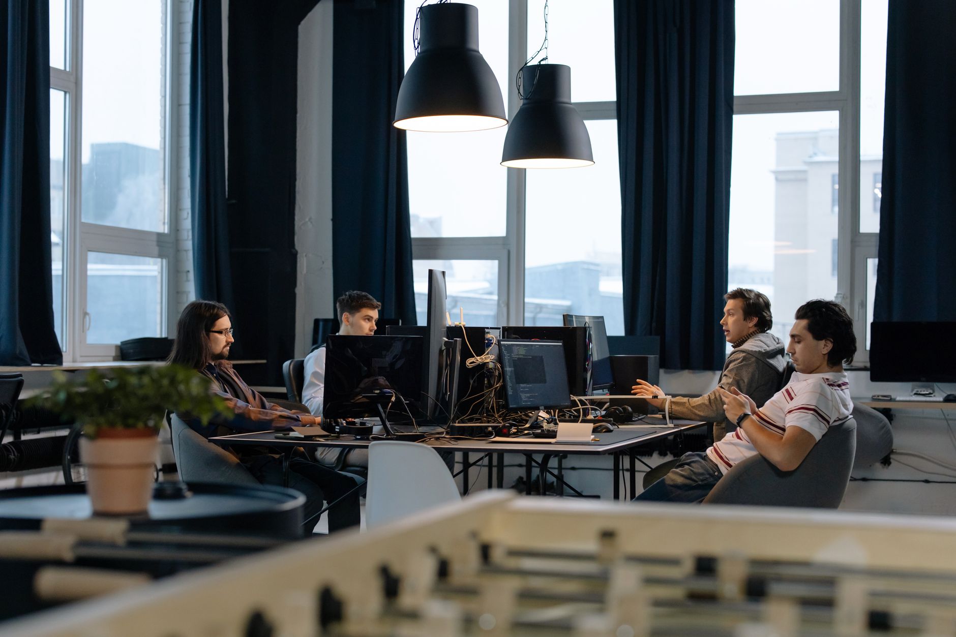 Software engineers collaborating in a modern open-plan office environment