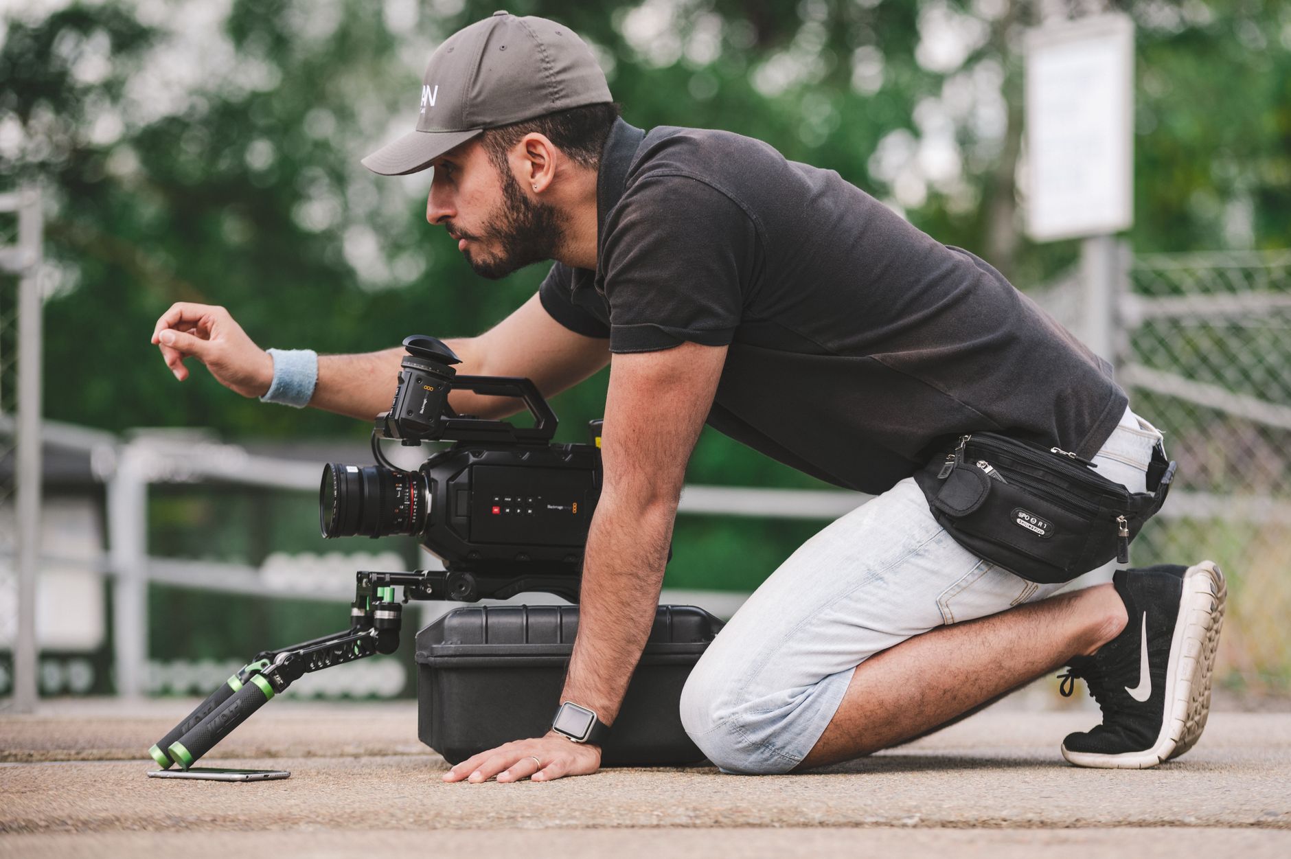 A filmmaker operating a camera on a professional production set