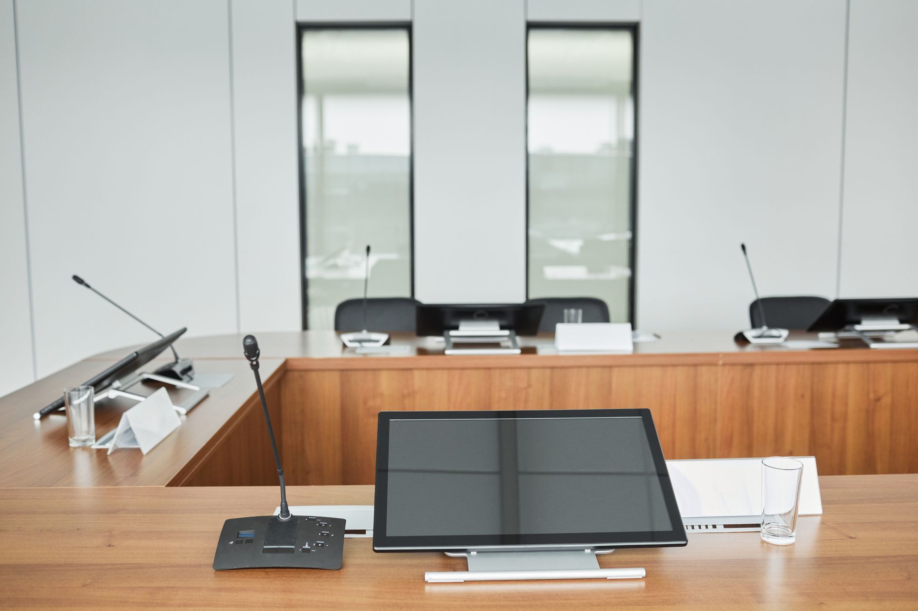 Empty corporate meeting room representing legal department decision-making