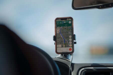 Mapbox’s Pricing Shift Is Pushing Developers Toward Google Maps Close-up of a smartphone displaying a digital map navigation application