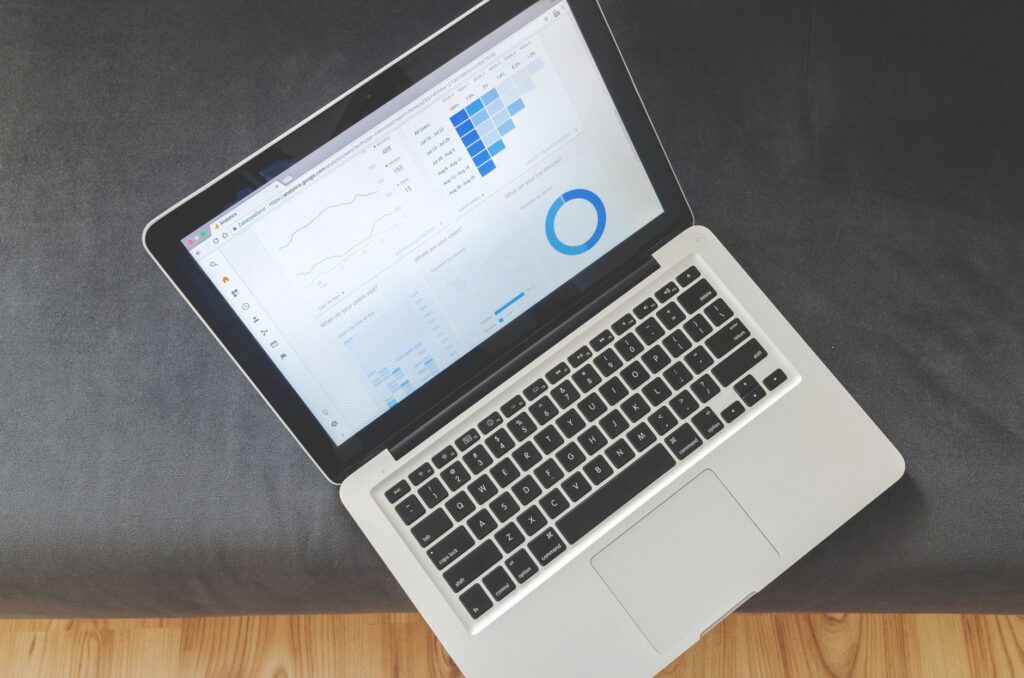 A person working on a data dashboard on a desktop computer in a modern office