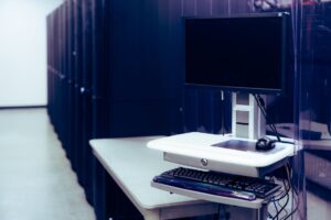 Rows of server hardware in a data center representing AI inference infrastructure