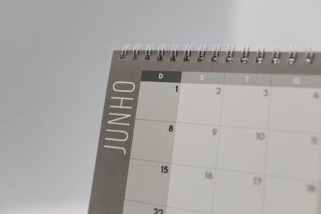 Notion’s Calendar Push Is Squeezing Cron’s Power User Base A clean desk workspace with a calendar and laptop open for daily planning