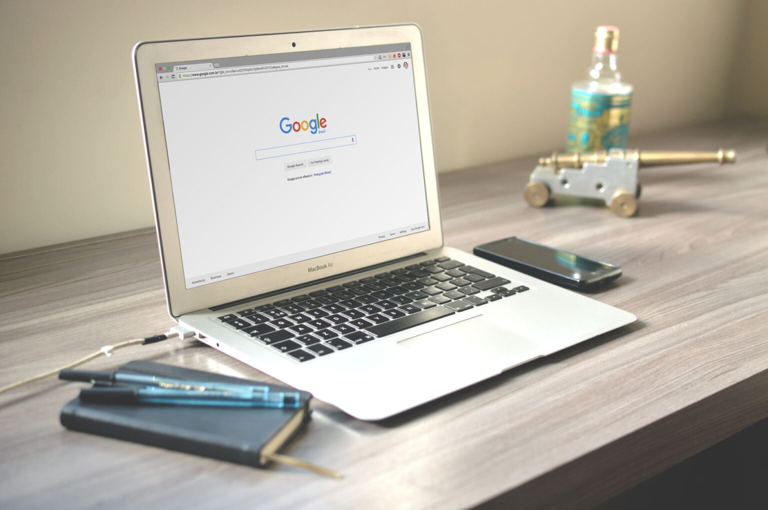 Glean’s Enterprise Search Push Is Cornering Guru’s Knowledge Base Employee using enterprise search software on a laptop in a modern office setting