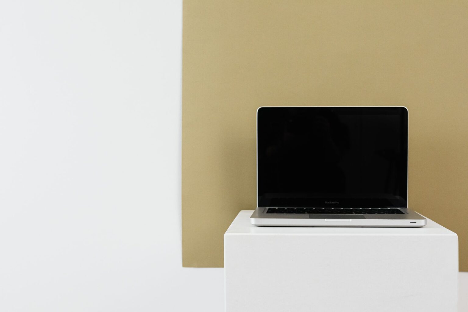 Gamma’s AI Presentation Tool Is Circling Canva’s Docs Base Person working on a presentation design on a laptop computer