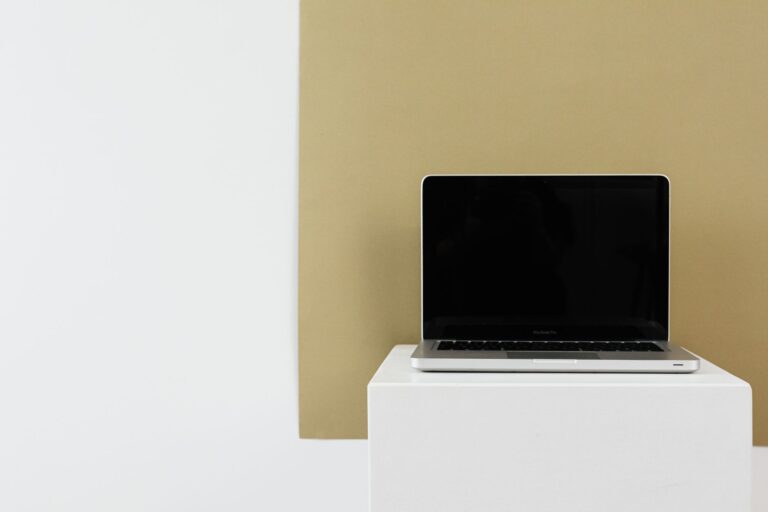 Gamma’s AI Presentation Tool Is Circling Canva’s Docs Base Person working on a presentation design on a laptop computer
