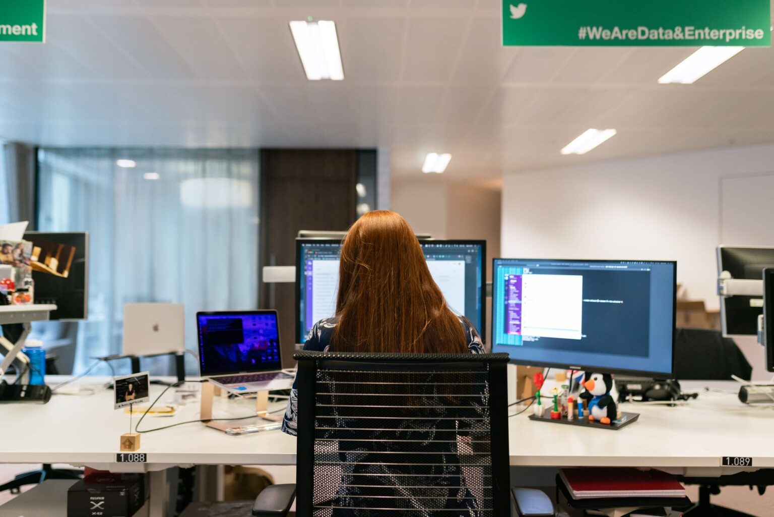 Notion’s AI Database Push Is Squeezing Coda’s Power User Base Person working on a productivity app on a laptop at a modern desk