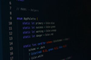 A developer looking at a web application interface on a computer screen