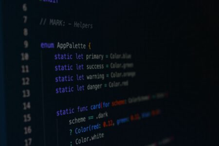 A developer looking at a web application interface on a computer screen