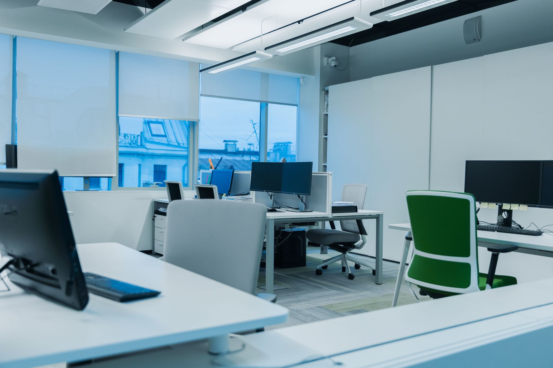 Open office with computers and IT equipment representing modern workplace technology management