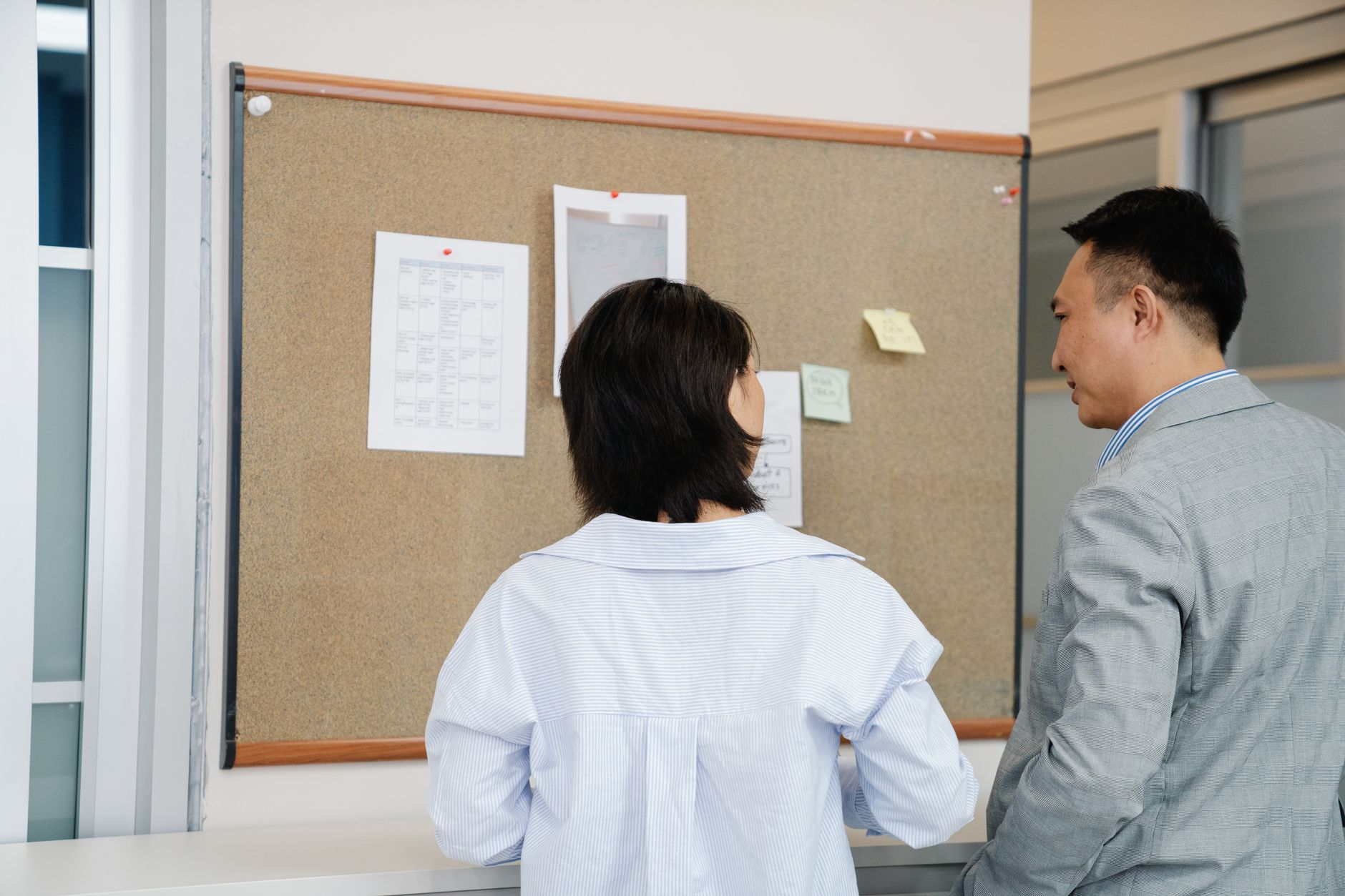 Engineering team reviewing a project roadmap on a whiteboard