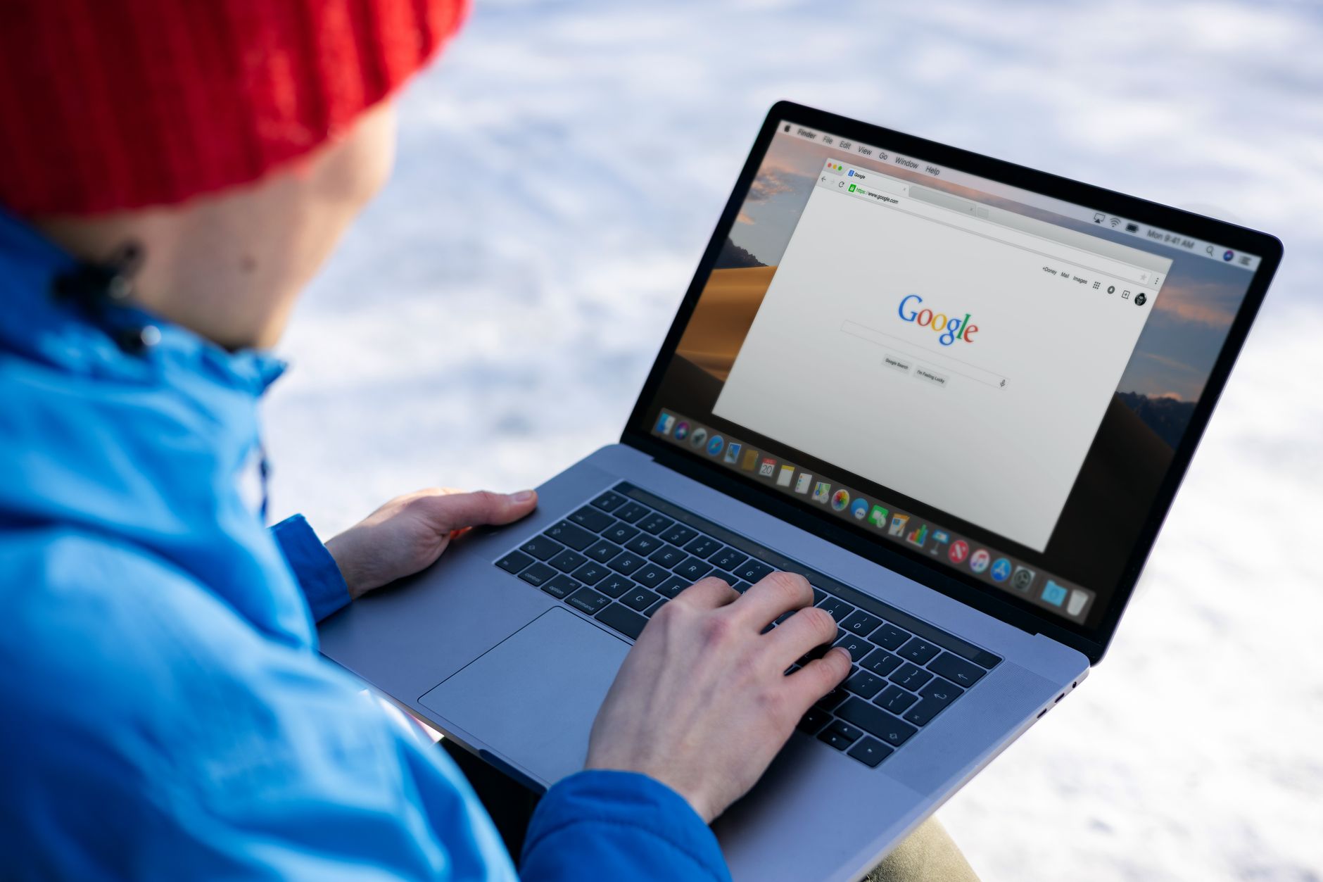 Person using a laptop to search online, illustrating the shift from traditional search to AI-powered answers